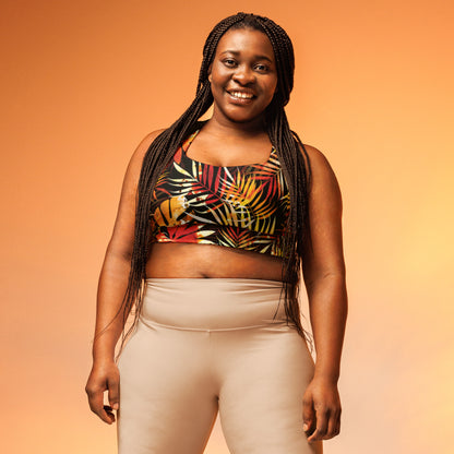 Longline sports bra with tropical leaf print, scoop front and racerback on black with red and yellow