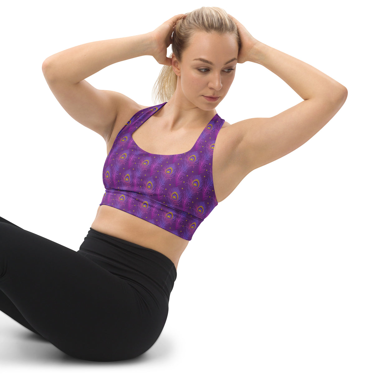 Purple longline sports bra with peacock-feather print and scoop neckline