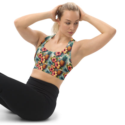 Teal pineapple and hibiscus print longline sports bra with wide straps, side view