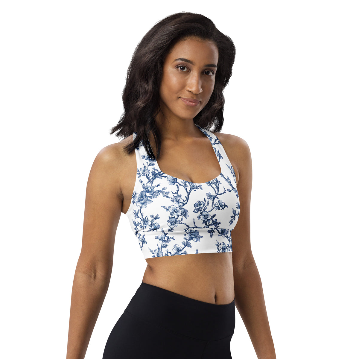 Blue floral longline sports bra with scoop neckline and supportive racerback