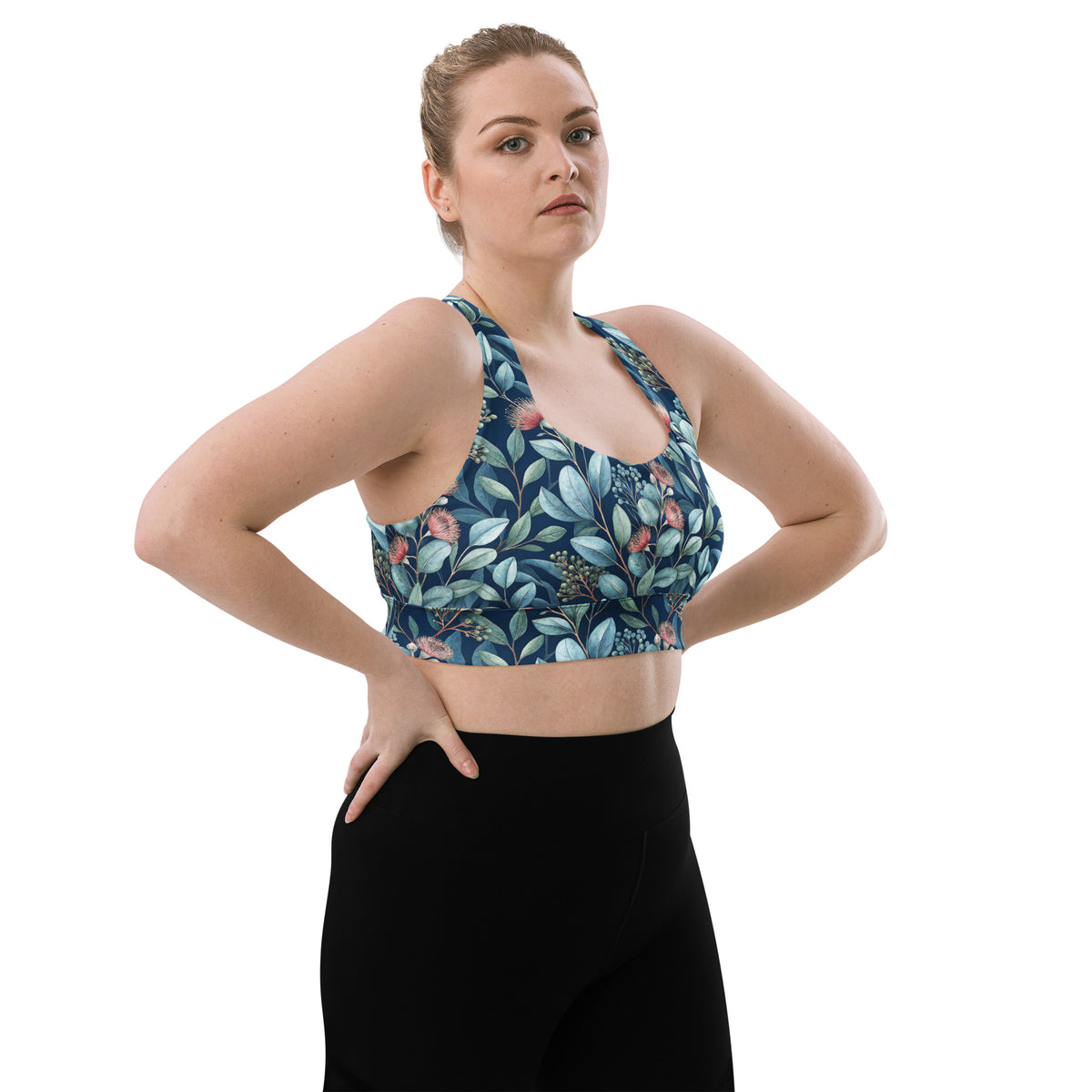 Front view longline sports bra with blue botanical print and scoop racerback neckline