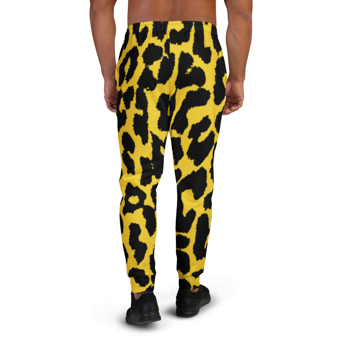 Men's leopard print joggers, yellow with black spots, elastic waistband and straight tapered legs