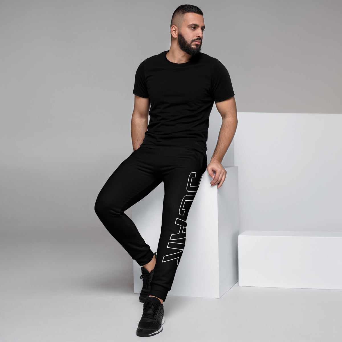 Black men's joggers with large white vertical logo detail on the leg
