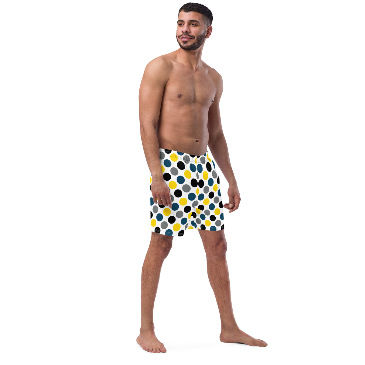 Polka dot swim trunks in white with blue, yellow, and black dots, straight hem