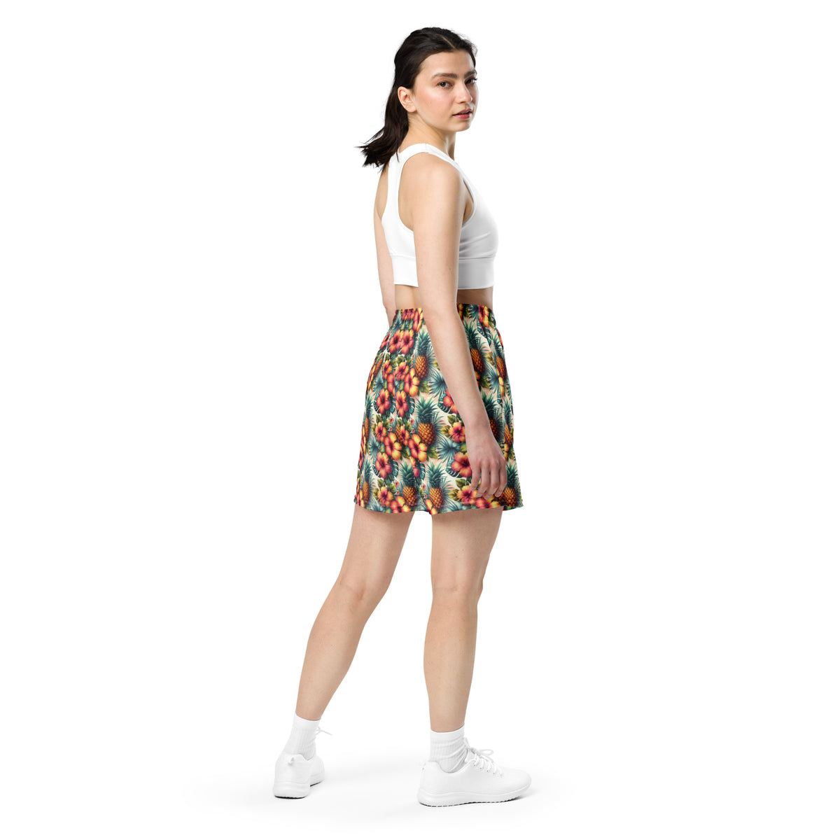 Tropical printed unisex shorts with elastic waistband, worn from side view on model