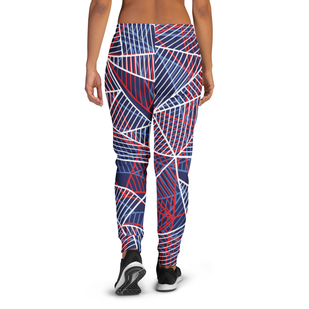 Women’s performance jogger pants with abstract blue, red, and white line graphic.