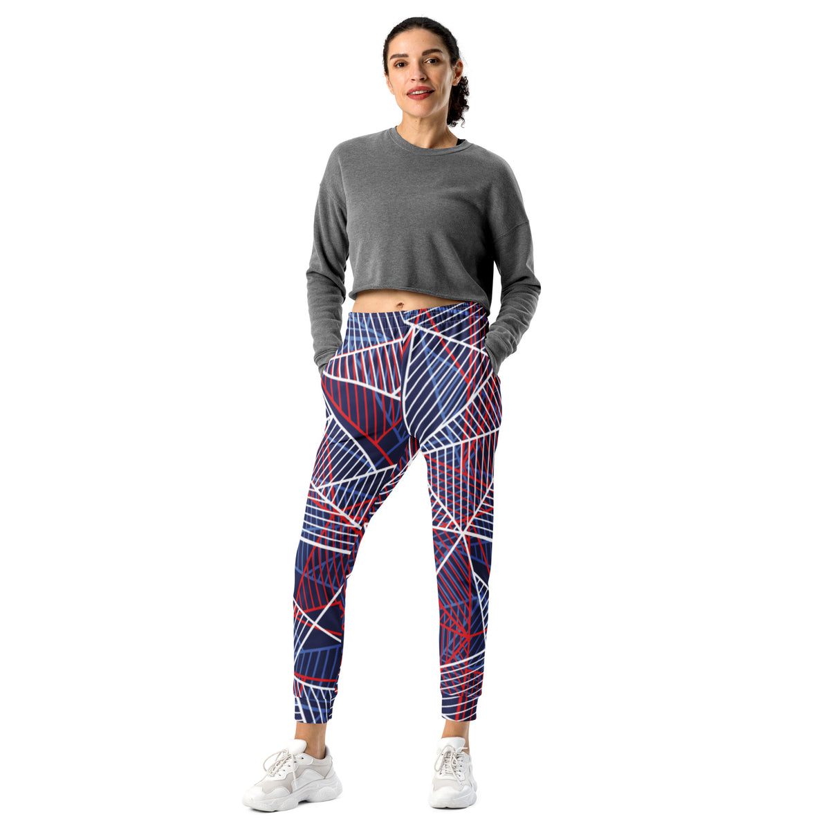 Women’s printed jogger pants with bold abstract lines in navy, red, and white.