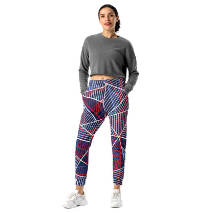 Women’s printed jogger pants with bold abstract lines in navy, red, and white.