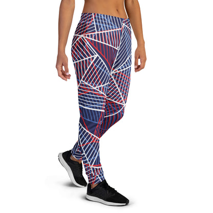 Women’s jogger pants with bold abstract line print in navy, red, and white.