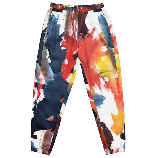 Unisex track pants with colorful pop-art paint splatter print on navy, red, blue, yellow.