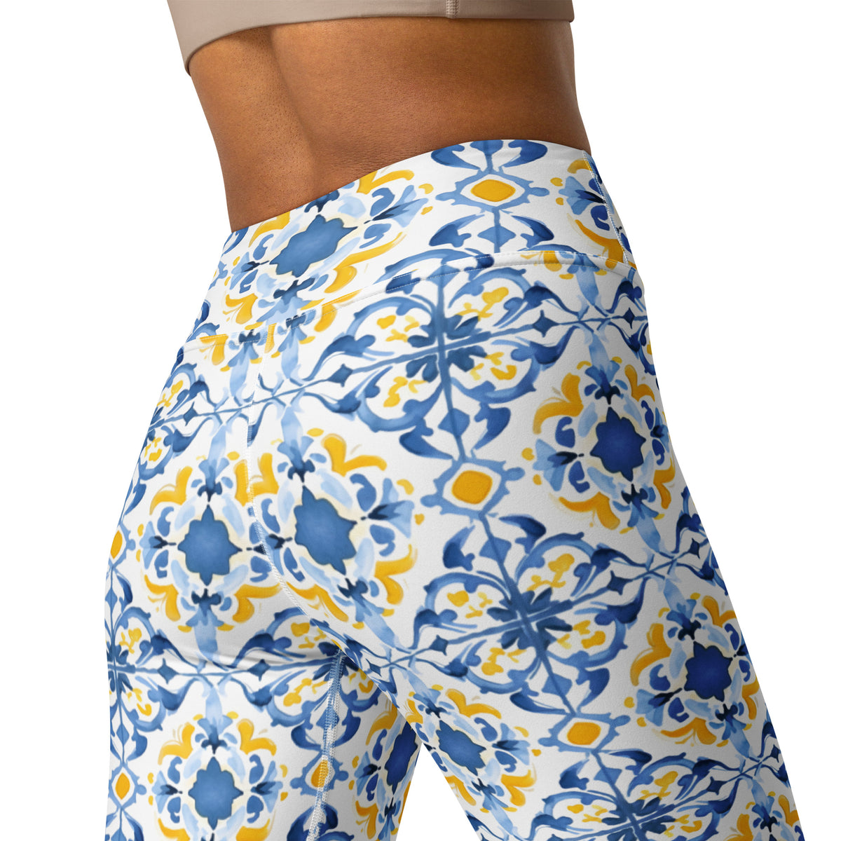 Blue and yellow floral yoga leggings with tile-style print, close-up