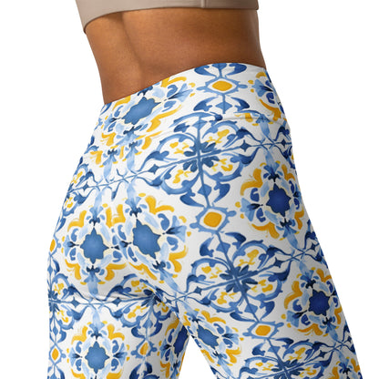 Blue and yellow floral yoga leggings with tile-style print, close-up