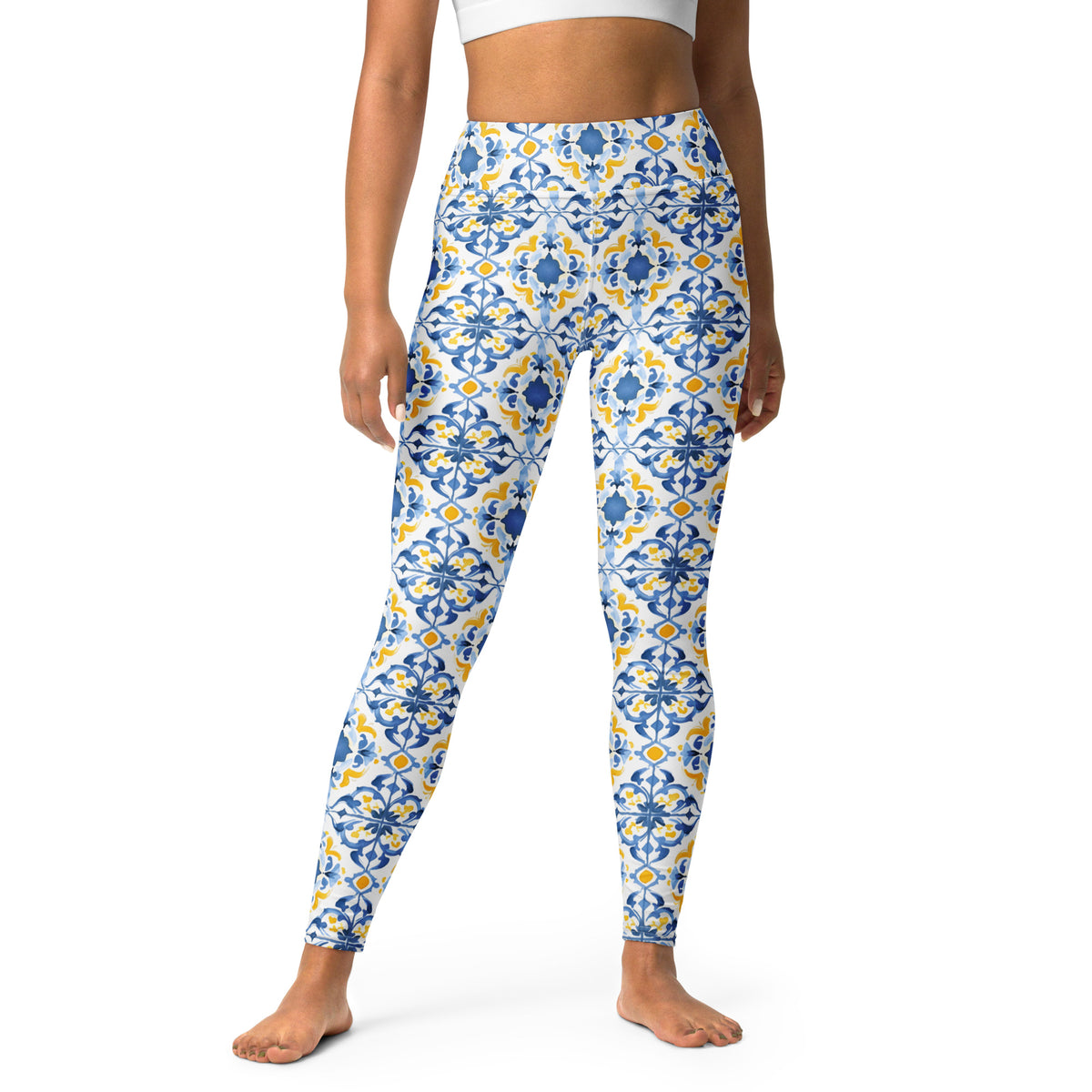 High-waist leggings with blue and white Moroccan tile floral print, full-length.