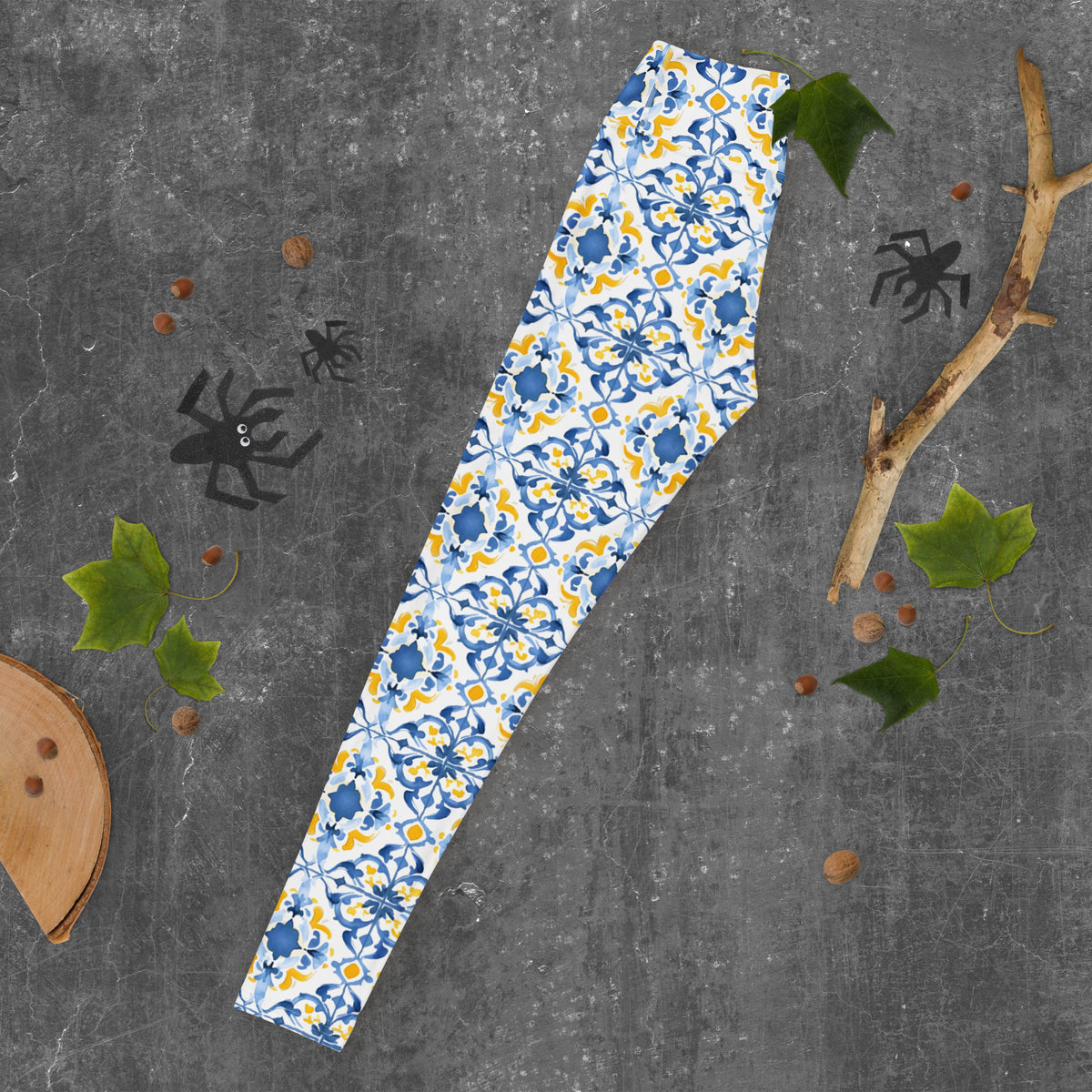 Leggings with blue and white Moroccan tile floral pattern, full-length.