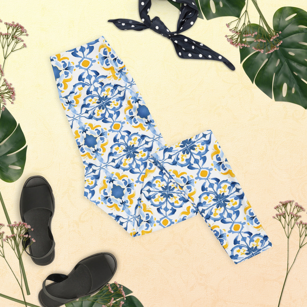 Leggings with blue and white Moroccan tile floral pattern, folded layout.