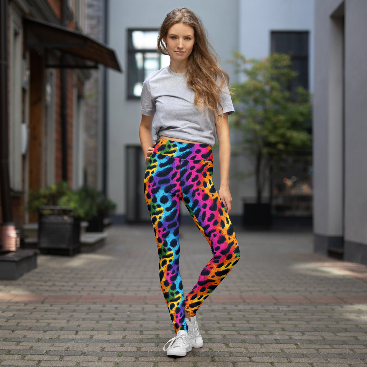 Rainbow leopard print yoga leggings on model walking, full-length slim fit.