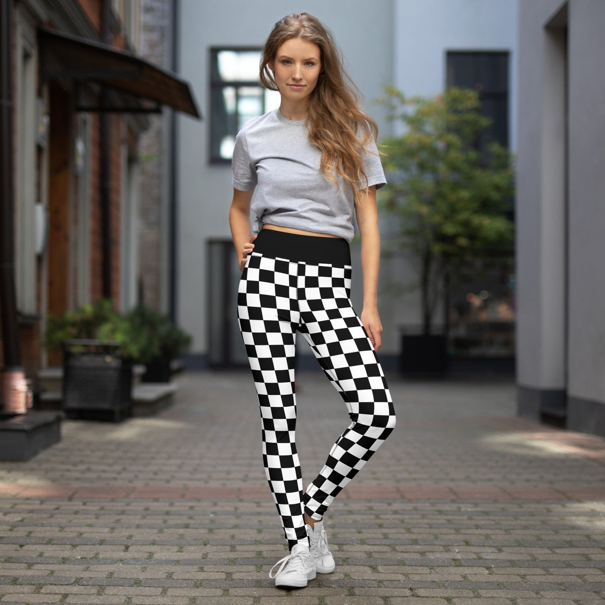 Black-and-white checkered yoga leggings with high-rise waistband and full-length legs