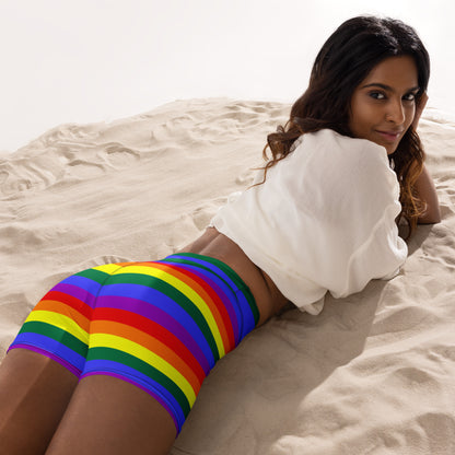 Rainbow striped yoga shorts with high waistband, model reclining