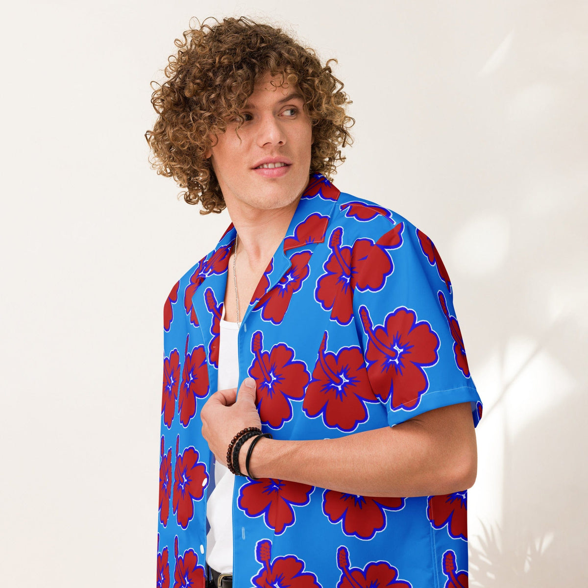 Blue Hawaiian floral shirt with red flowers, open collar and short sleeves.