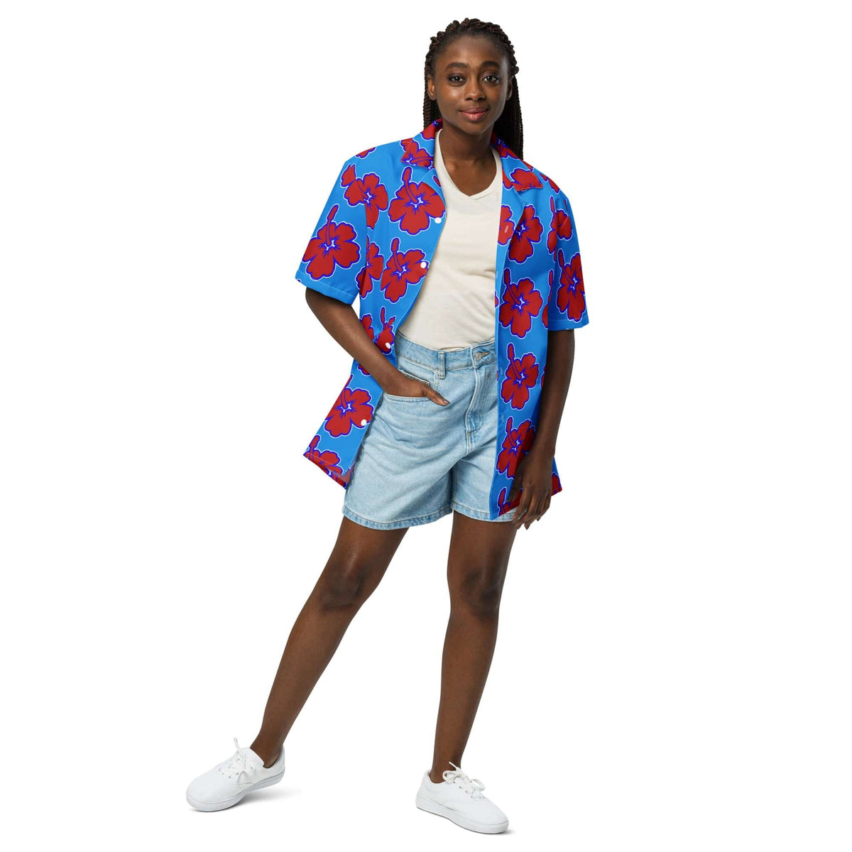 Blue Hawaiian floral shirt with red hibiscus print, worn with open collar and short sleeves.
