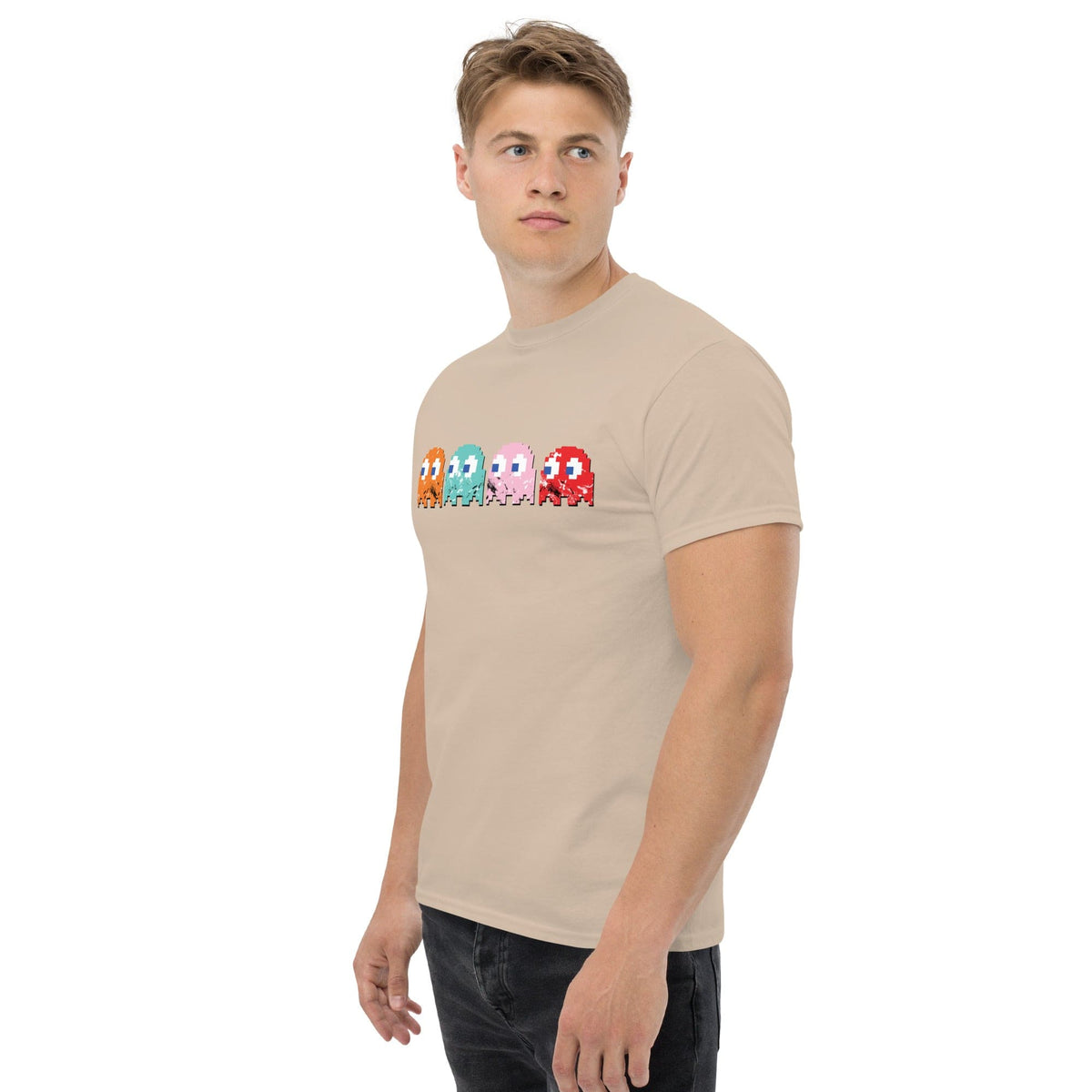 Sand T-shirt with pixel-style arcade characters graphic across the chest.