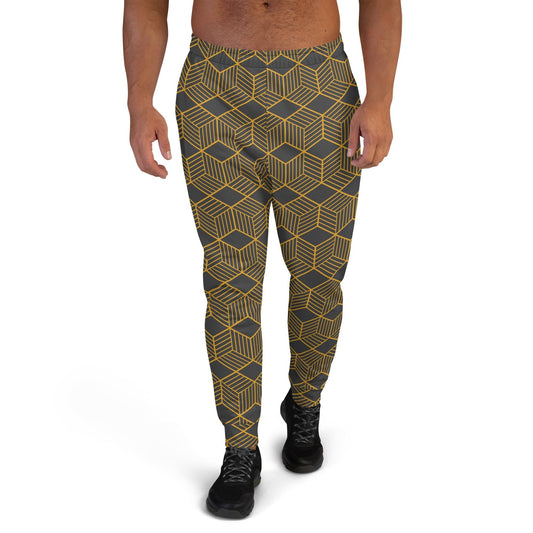 Men's joggers with geometric cube print, dark base and gold lines, tapered legs