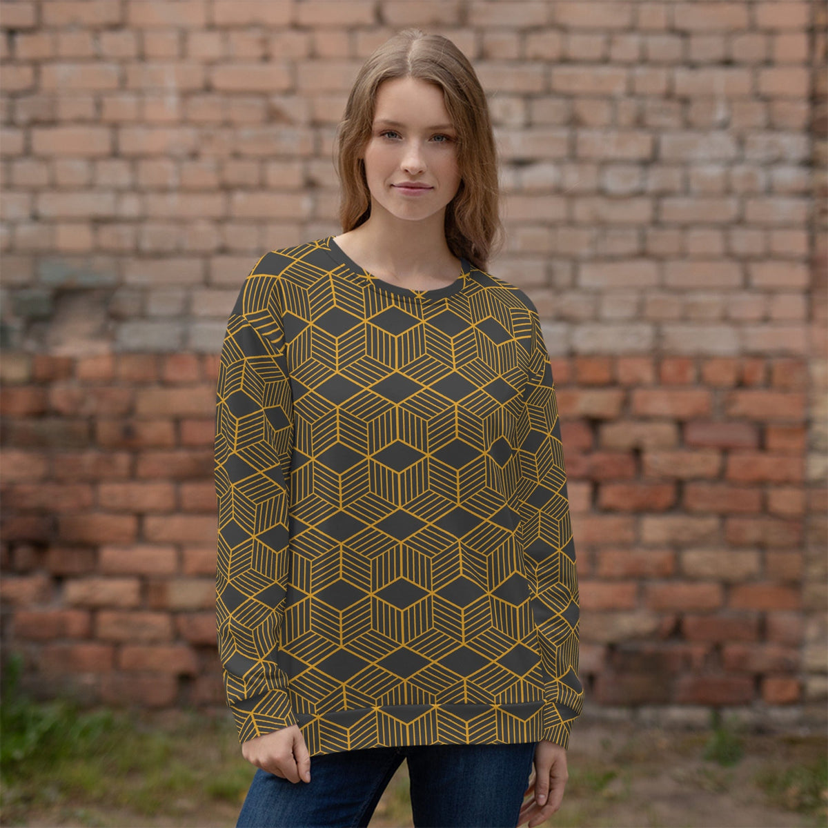 Unisex crewneck sweatshirt on model, dark base with gold cube geometric pattern, long sleeves