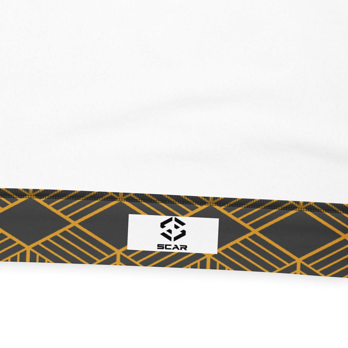 Unisex sweatshirt hem label with SCAR logo on dark fabric, gold geometric cube pattern