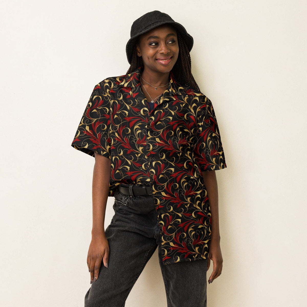 Baroque art short-sleeve button shirt in dark navy with red and gold swirling pattern.