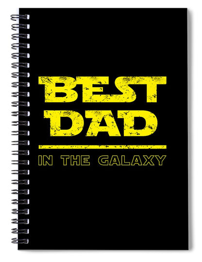 Spiral notebook with black cover and yellow 'BEST DAD IN THE GALAXY' print