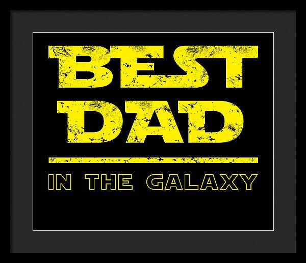 Dark gray-framed wall print featuring yellow "Best Dad in the Galaxy" lettering on black.