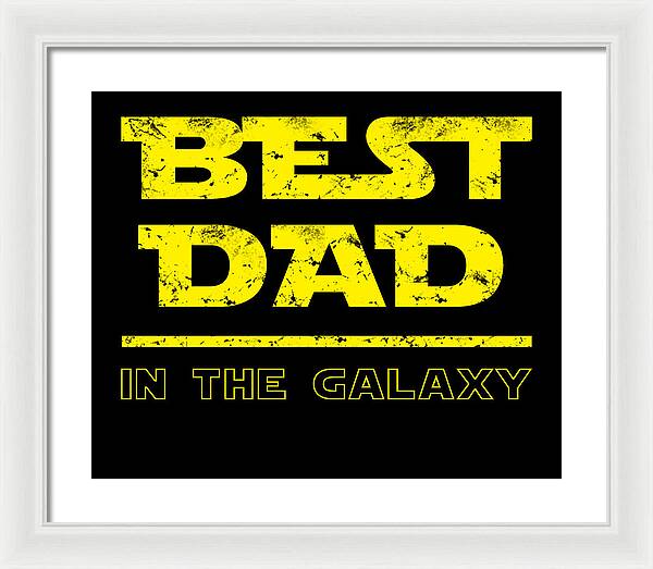 White-framed wall print with yellow "Best Dad in the Galaxy" text on black background.