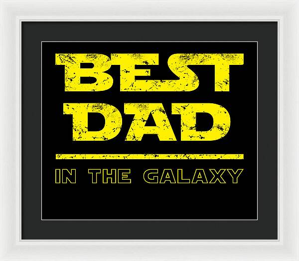 Dark gray-framed wall print with yellow "Best Dad in the Galaxy" text on black background.