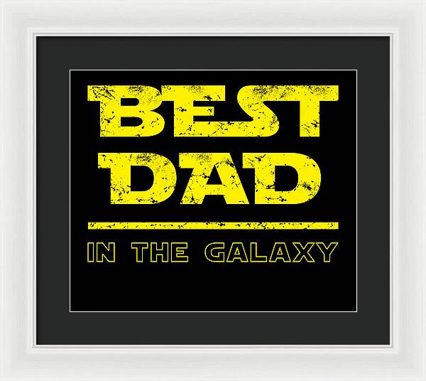 White-framed wall print featuring yellow "Best Dad in the Galaxy" lettering on black.