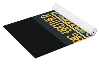 Yoga mat shown rolled with Big Brother is Watching eye design