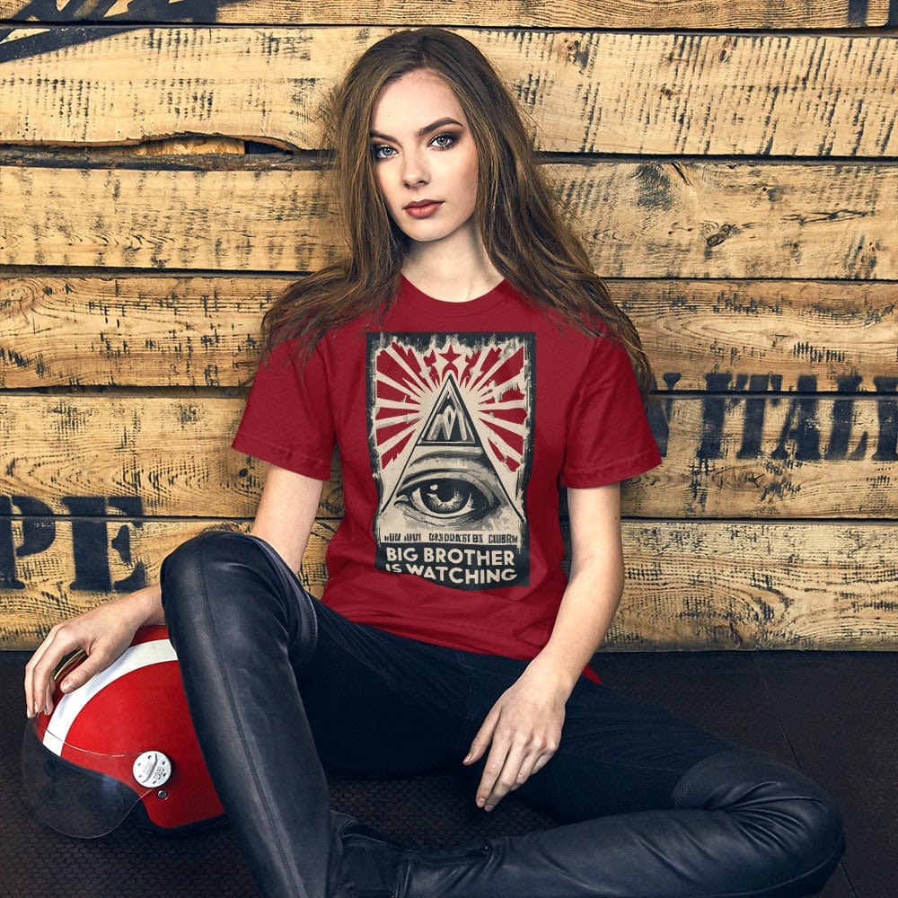 Red T-shirt with centered eye-and-pyramid graphic and bold text panel.