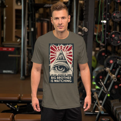Olive T-shirt with centered eye-and-pyramid graphic with red starburst and text.