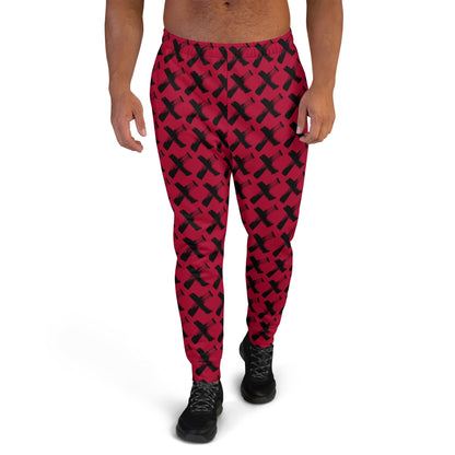 Men's red joggers with black X pattern, elastic cuffs and drawstring waistband