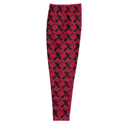 Men's red joggers with black X pattern, flat studio view with tapered leg