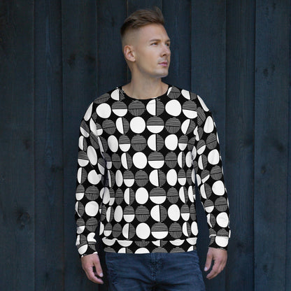 Black and white geometric print sweatshirt on model, crew neck and long sleeves.