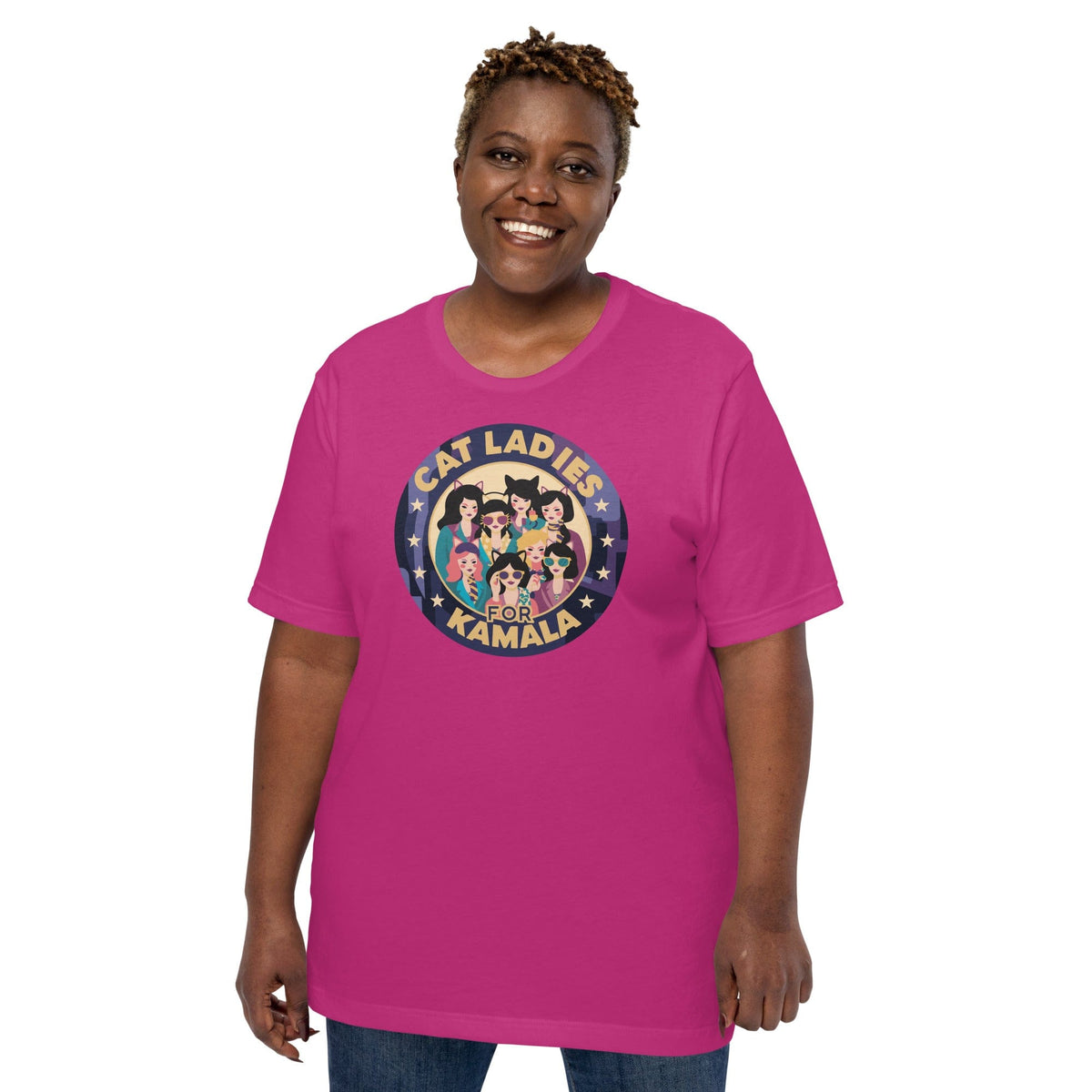 Pink T-shirt with round “CAT LADIES FOR KAMALA” cat graphic on the chest