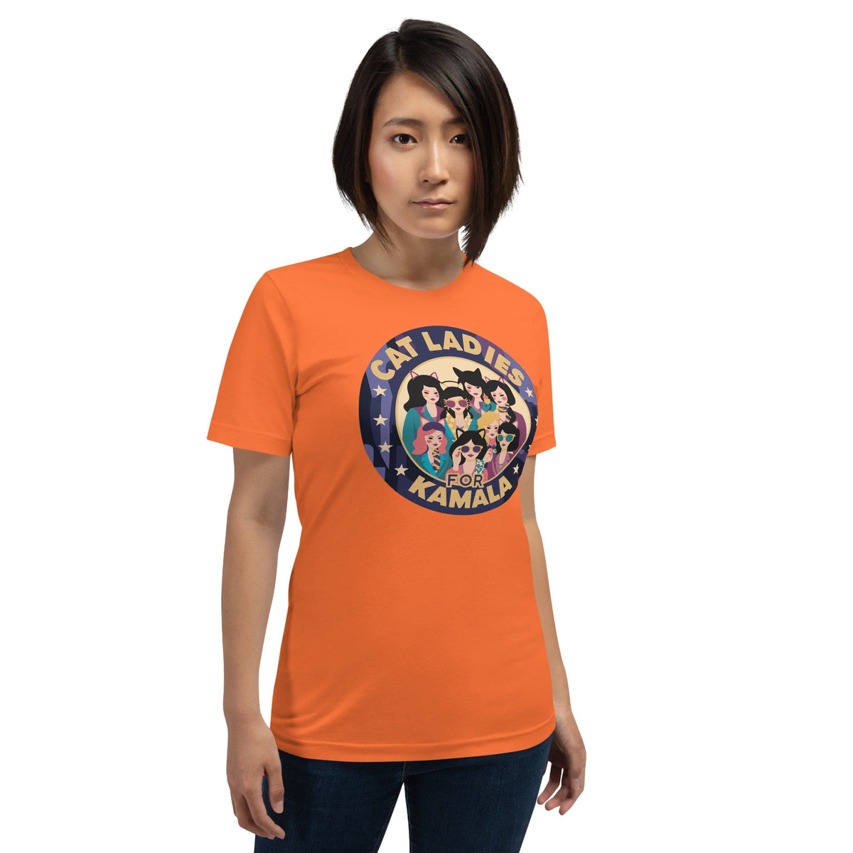 Orange T-shirt with round “CAT LADIES FOR KAMALA” cat graphic on the chest