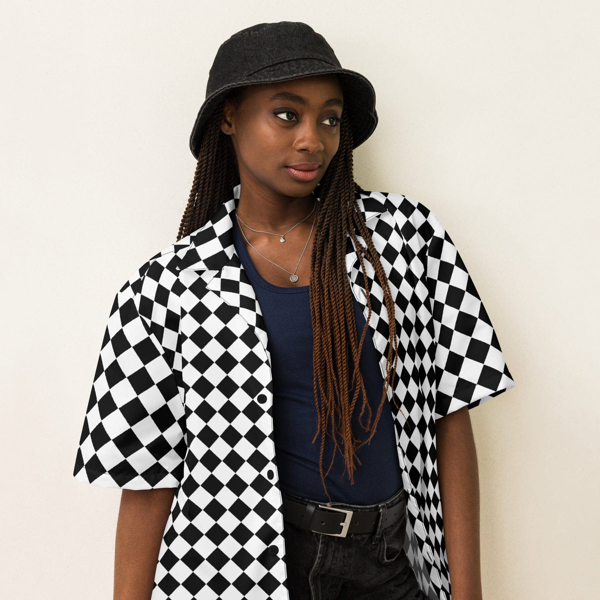 Unisex chessboard patterned button shirt with open collar and short sleeves, black/white.