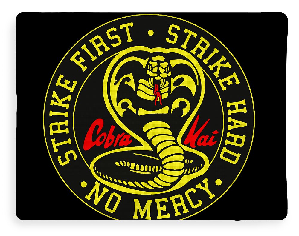 Black throw blanket with yellow circular emblem and bold “NO MERCY” lettering