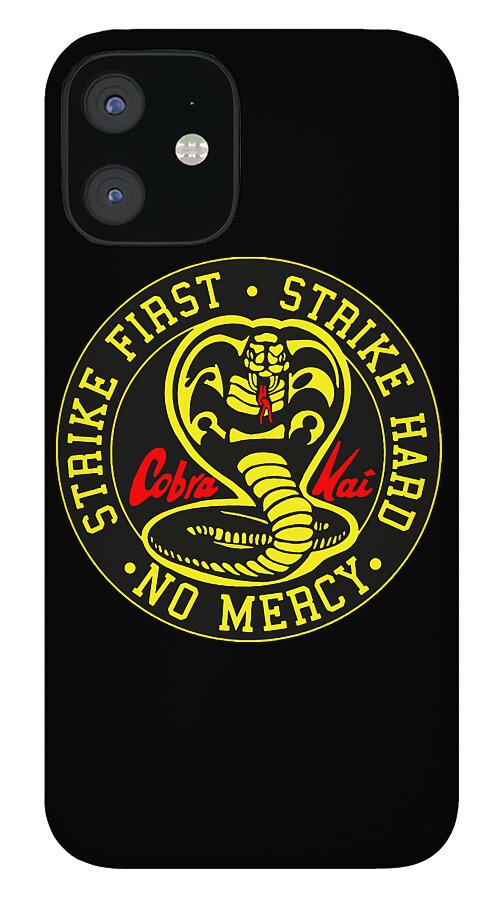 Black phone case with a circular Cobra Kai emblem and yellow text: “Strike First, No Mercy”.
