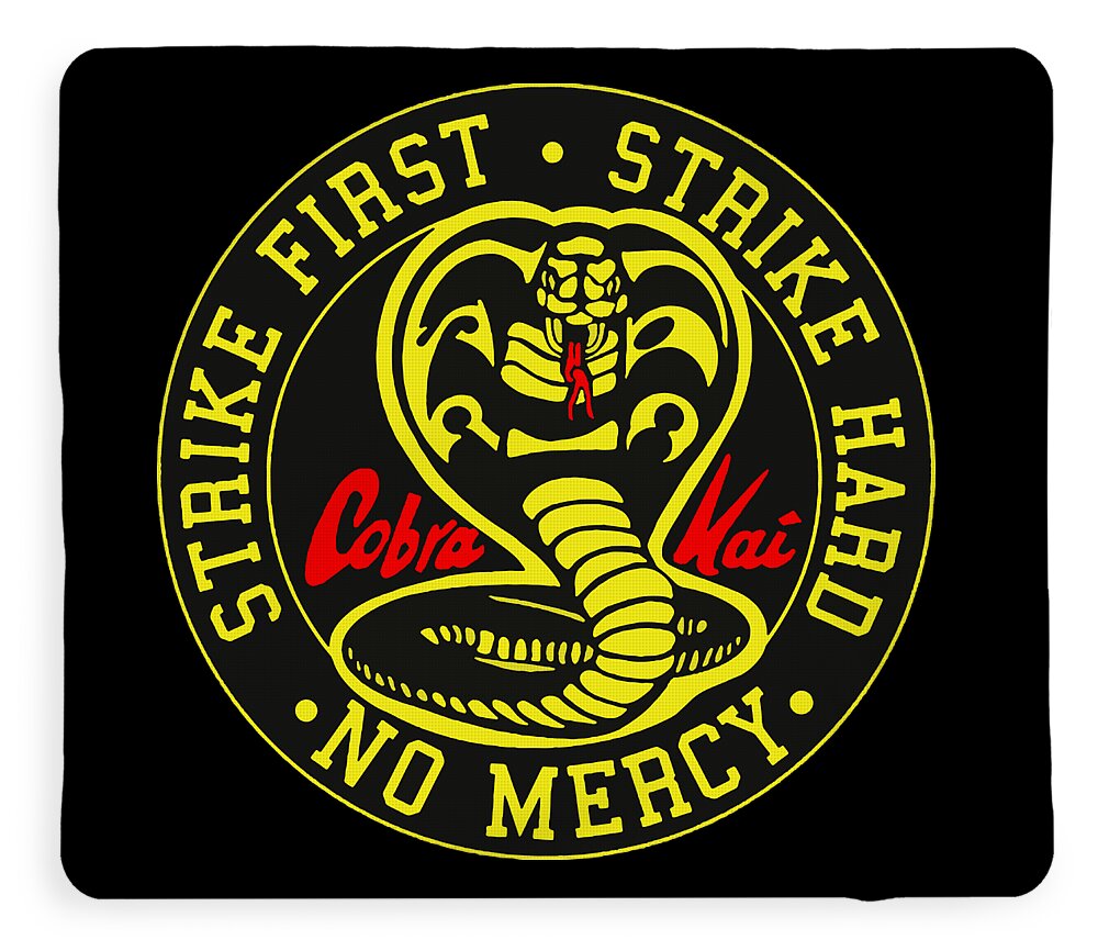 Black throw blanket with yellow circular logo, coiled cobra illustration, and ring text
