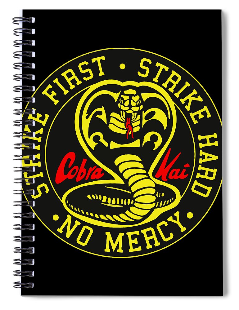 Black spiral notebook with Cobra Kai 'Strike First, No Mercy' circular graphic