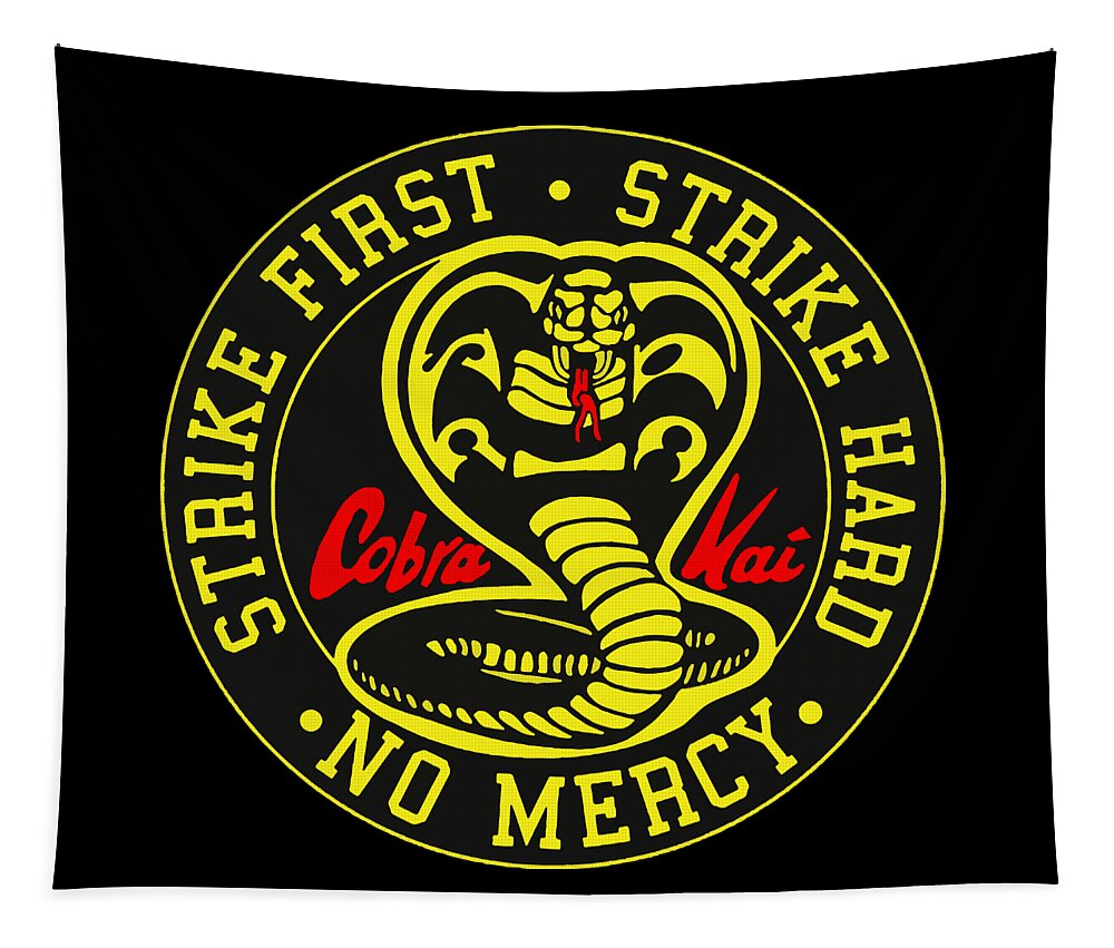 Black tapestry with large circular cobra emblem and 'NO MERCY' text in yellow