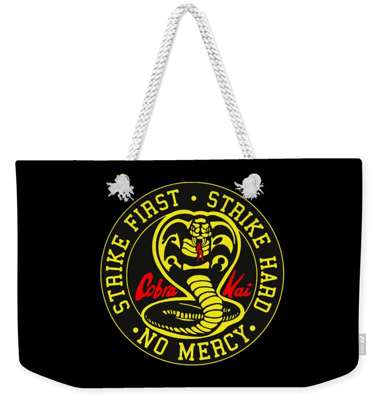 Weekender tote bag with black body, white rope handles, and cobra logo print