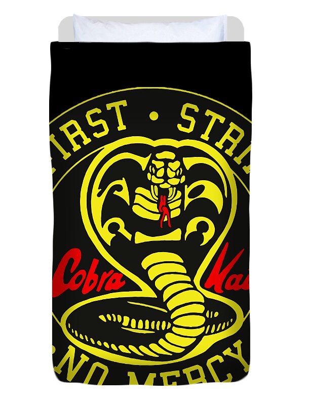 Black duvet cover with partial Cobra Kai Strike First emblem, cropped center.